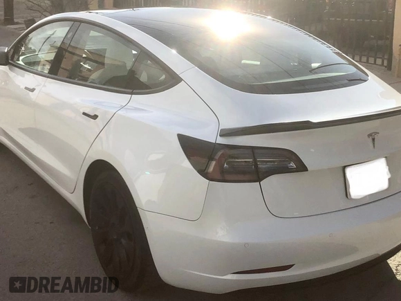 2021 Tesla Model 3 Standard Range Plus with VIN 5YJ3E1EA2MF854372, listed as a Copart auction lot 56435825 with 44,637 mi miles and Salvage Title. Bid and sale history available at DreamBid. Image 3.