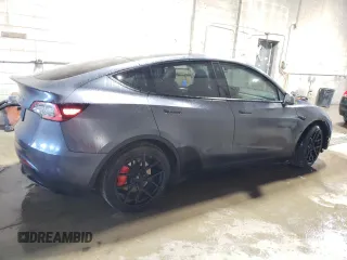 2021 Tesla Model Y Performance with VIN 5YJYGDEF2MF134700, listed as a Copart auction lot 56325685 with 66,730 mi miles and Salvage Title. Bid and sale history available at DreamBid. Image 3.