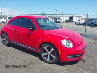 2012 Volkswagen Beetle 2.0T Turbo w/Sun/Snd/Nav PZEV with VIN 3VWVA7AT4CM608798, listed as a IAAI auction lot 42130353 with 152,052 mi miles. Bid and sale history available at carsss.com. Image 1.