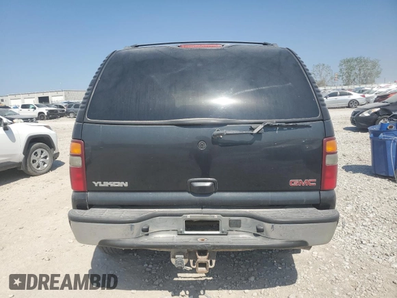 2003 GMC Yukon SLT z VIN 1GKEK13Z93J159795, wystawiony jako Copart lot #64915913 z przebiegiem 414 569 mil mil oraz Szkoda całkowita • Salvage title. Historia ofert i sprzedaży dostępna na DreamBid. Obrazek 6.