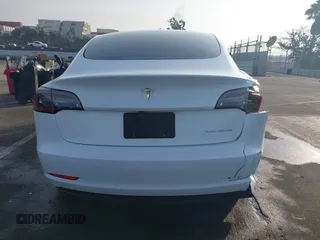 2021 Tesla Model 3 Long Range with VIN 5YJ3E1EB0MF009965, listed as a IAAI auction lot 41478233 with 31,713 mi miles and . Bid and sale history available at DreamBid. Image 16.