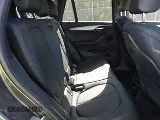 2017 BMW X1 xDrive28i with VIN WBXHT3C31H5F80056, listed as a IAAI auction lot 42049925 with 64,471 mi miles and . Bid and sale history available at DreamBid. Image 8.