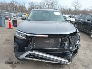 2021 Volkswagen Atlas SE z VIN 1V2KR2CA0MC570498, wystawiony jako IAAI lot #41807676 z przebiegiem 56 434 mil mil oraz . Historia ofert i sprzedaży dostępna na DreamBid. Obrazek 13.