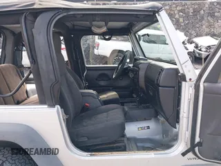2004 Jeep Wrangler Sport with VIN 1J4FA49S04P781581, listed as a IAAI auction lot 42078693 with 111,123 mi miles and . Bid and sale history available at DreamBid. Image 5.
