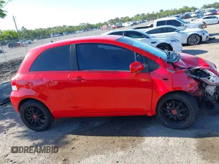 2009 Toyota Yaris with VIN JTDJT903695234623, listed as a IAAI auction lot 42027852 with 146,000 mi miles. Bid and sale history available at carsss.com. Image 13.