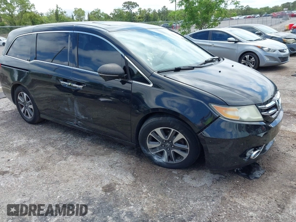 2014 Honda Odyssey Touring with VIN 5FNRL5H94EB057499, listed as a IAAI auction lot 41983956 with 158,573 mi miles and . Bid and sale history available at DreamBid. Image 1.