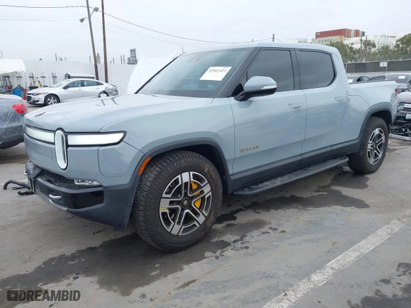 2023 Rivian R1T Launch Edition with VIN 7FCTGAAL3PN017339, listed as a IAAI auction lot 42041423 with 15,098 mi miles. Bid and sale history available at carsss.com. Image 21.