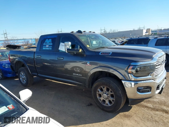 2021 Ram 2500 Laramie z VIN 3C6UR5FL7MG629012, wystawiony jako IAAI lot #41369353 z przebiegiem 168 099 mil mil oraz . Historia ofert i sprzedaży dostępna na DreamBid. Obrazek 13.