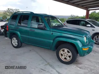 2004 Jeep Liberty Limited with VIN 1J4GK58K94W104382, listed as a IAAI auction lot 40214679 with 143,836 mi miles. Bid and sale history available at carsss.com. Image 1.