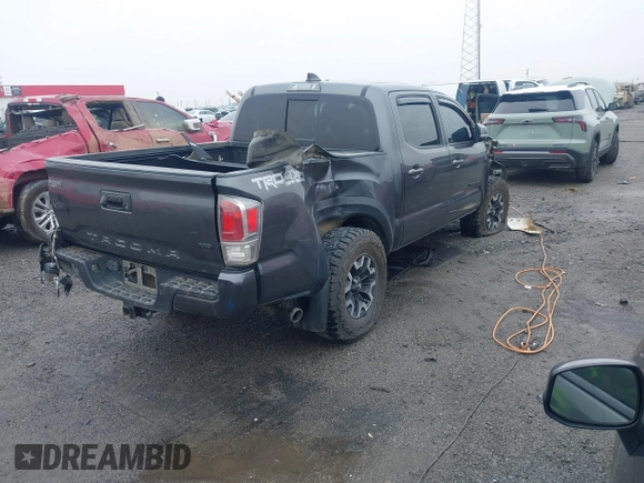 2022 Toyota Tacoma SR with VIN 3TMCZ5AN1NM476353, listed as a IAAI auction lot 41938107 with 51,782 mi miles and . Bid and sale history available at DreamBid. Image 4.