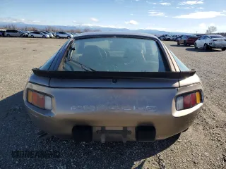 1984 Porsche 928 z VIN WP0JB0920ES860222, wystawiony jako Copart lot #44055645 z przebiegiem 166 689 mil mil oraz Nie do naprawy. Historia ofert i sprzedaży dostępna na DreamBid. Obrazek 6.