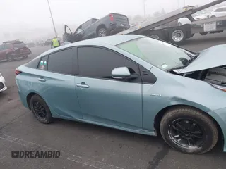 2022 Toyota Prius L Eco with VIN JTDKAMFU9N3186859, listed as a IAAI auction lot 41486941 with 122,665 mi miles and . Bid and sale history available at DreamBid. Image 13.