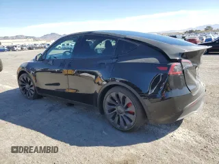2023 Tesla Model Y Performance with VIN 7SAYGDEF7PF924355, listed as a Copart auction lot 47877055 with 64,663 mi miles and Salvage Title. Bid and sale history available at DreamBid. Image 2.