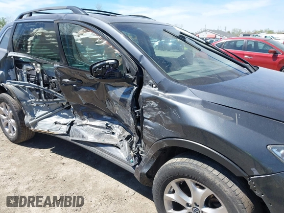 2015 Mazda CX-9 Touring z VIN JM3TB3CV3F0465162, wystawiony jako IAAI lot #42112814 z przebiegiem 108 623 mil mil oraz . Historia ofert i sprzedaży dostępna na DreamBid. Obrazek 6.