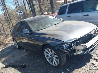 2018 BMW 3 Series 320i xDrive with VIN WBA8E5G55JNU47024, listed as a IAAI auction lot 41703707 with 202,853 mi miles. Bid and sale history available at carsss.com. Image 1.