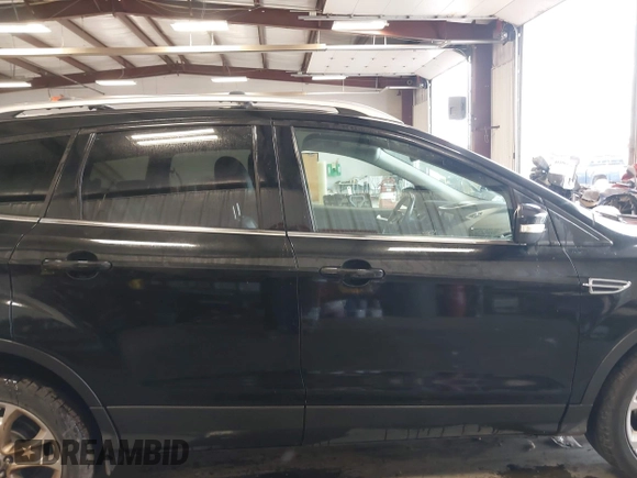 2015 Ford Escape Titanium with VIN 1FMCU9J98FUC70495, listed as a IAAI auction lot 41978543 with 129,974 mi miles. Bid and sale history available at carsss.com. Image 13.