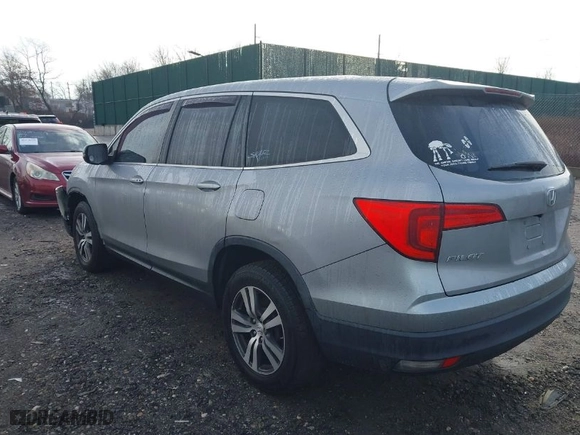 2018 Honda Pilot EX-L with VIN 5FNYF6H59JB026068, listed as a IAAI auction lot 41458049 with 128,769 mi miles. Bid and sale history available at carsss.com. Image 3.