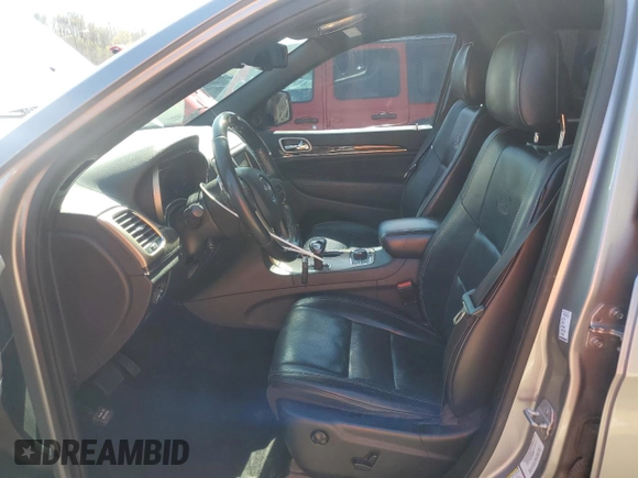 2014 Jeep Grand Cherokee Overland with VIN 1C4RJFCG0EC542527, listed as a Copart auction lot 51776655 with 167,703 mi miles and Salvage Title. Bid and sale history available at DreamBid. Image 7.