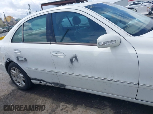 2003 Mercedes-Benz E-Class 3.2L with VIN WDBUF65J23A120318, listed as a IAAI auction lot 41927993 with 113,578 mi miles. Bid and sale history available at carsss.com. Image 13.