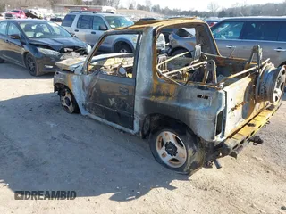 1996 Chevrolet Tracker z VIN 2CNBJ1869T6914128, wystawiony jako IAAI lot #41399004 z przebiegiem Nie podano mil oraz . Historia ofert i sprzedaży dostępna na DreamBid. Obrazek 3.
