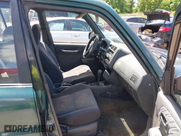 1998 Toyota RAV4 with VIN JT3GP10V6W0023680, listed as a IAAI auction lot 42235877 with 244,446 mi miles and . Bid and sale history available at DreamBid. Image 5.