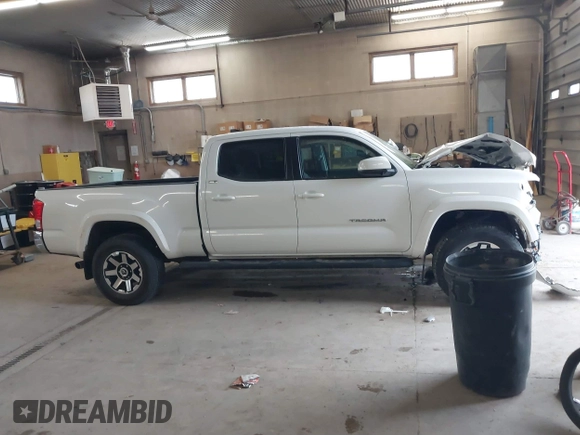 2016 Toyota Tacoma SR5 with VIN 3TMDZ5BN2GM007990, listed as a IAAI auction lot 41288736 with 76,179 mi miles. Bid and sale history available at carsss.com. Image 13.