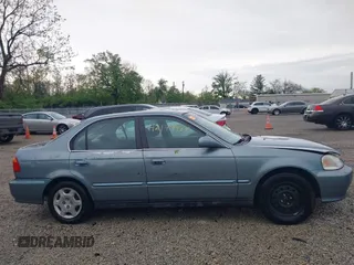 2000 Honda Civic EX z VIN 1HGEJ8644YL006150, wystawiony jako IAAI lot #42149964 z przebiegiem 195 489 mil mil oraz . Historia ofert i sprzedaży dostępna na DreamBid. Obrazek 14.