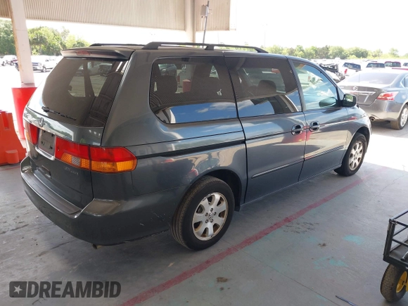 2004 Honda Odyssey EX with VIN 5FNRL18624B056333, listed as a IAAI auction lot 42143860 with 165,687 mi miles and . Bid and sale history available at DreamBid. Image 4.