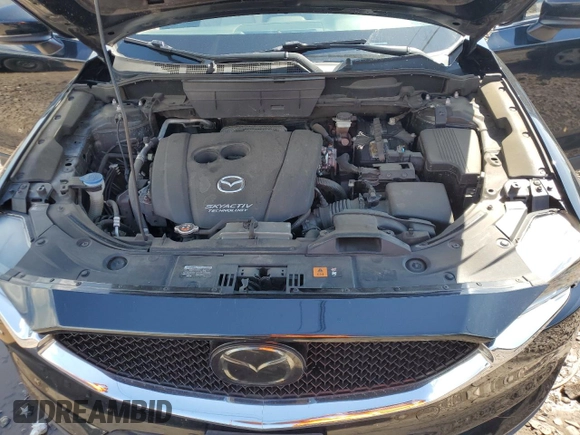 2018 Mazda CX-5 Grand Touring with VIN JM3KFBDM6J0345848, listed as a Copart auction lot 61587865 with 107,193 mi miles and Salvage title. Bid and sale history available at DreamBid. Image 12.