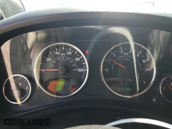 2011 Jeep Wrangler Sahara with VIN 1J4AA5D14BL542912, listed as a Copart auction lot 65158784 with 122,795 mi miles and Salvage Title. Bid and sale history available at DreamBid. Image 9.
