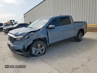 2023 Honda Ridgeline RTL-E with VIN 5FPYK3F76PB036572, listed as a Copart auction lot 54717085 with 34,516 mi miles and Salvage title. Bid and sale history available at DreamBid. Image 1.
