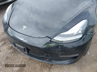 2018 Tesla Model 3 Long Range Battery z VIN 5YJ3E1EB3JF127410, wystawiony jako IAAI lot #41994858 z przebiegiem 100 494 mil mil oraz . Historia ofert i sprzedaży dostępna na DreamBid. Obrazek 6.