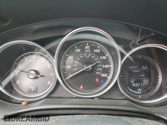 2014 Mazda CX-5 Touring z VIN JM3KE4CY0E0407169, wystawiony jako Copart lot #57877215 z przebiegiem 168 277 mil mil oraz Szkoda całkowita • Salvage title. Historia ofert i sprzedaży dostępna na DreamBid. Obrazek 9.