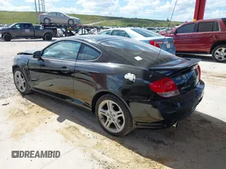2006 Hyundai Tiburon GT z VIN KMHHN65F56U224768, wystawiony jako IAAI lot #40672721 z przebiegiem 158 535 mil mil oraz . Historia ofert i sprzedaży dostępna na DreamBid. Obrazek 3.