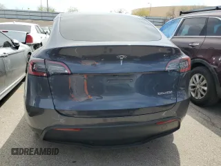 2022 Tesla Model Y Performance with VIN 7SAYGDEF1NF491967, listed as a Copart auction lot 51119515 with 50,520 mi miles and Salvage title. Bid and sale history available at DreamBid. Image 6.