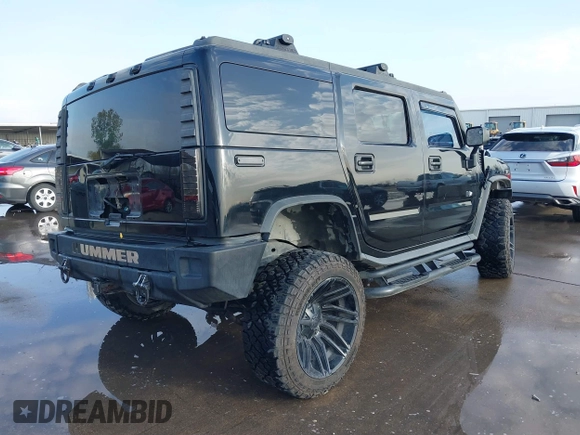 2003 Hummer H2 z VIN 5GRGN23UX3H112173, wystawiony jako IAAI lot #41093359 z przebiegiem Nie podano mil oraz . Historia ofert i sprzedaży dostępna na DreamBid. Obrazek 4.