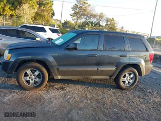 2007 Jeep Grand Cherokee Laredo with VIN 1J8GS48K17C655999, listed as a IAAI auction lot 41590500 with 290,695 mi miles. Bid and sale history available at carsss.com. Image 14.