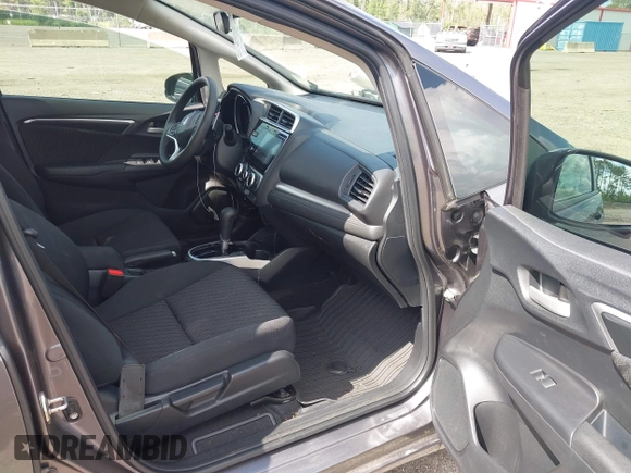 2019 Honda Fit EX z VIN 3HGGK5H89KM736677, wystawiony jako IAAI lot #42443401 z przebiegiem 58 559 mil mil oraz . Historia ofert i sprzedaży dostępna na DreamBid. Obrazek 5.