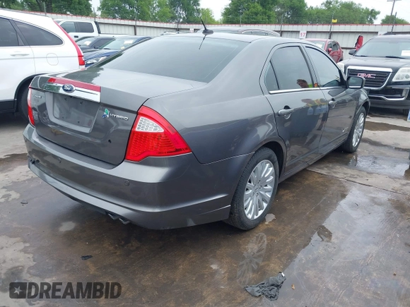 2012 Ford Fusion Hybrid z VIN 3FADP0L33CR289548, wystawiony jako IAAI lot #41905806 z przebiegiem 121 233 mil mil oraz . Historia ofert i sprzedaży dostępna na DreamBid. Obrazek 4.