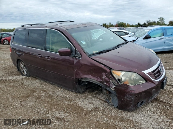 2010 Honda Odyssey Touring with VIN 5FNRL3H94AB056657, listed as a Copart auction lot 72658934 with 202,690 mi miles and Salvage title. Bid and sale history available at DreamBid. Image 4.