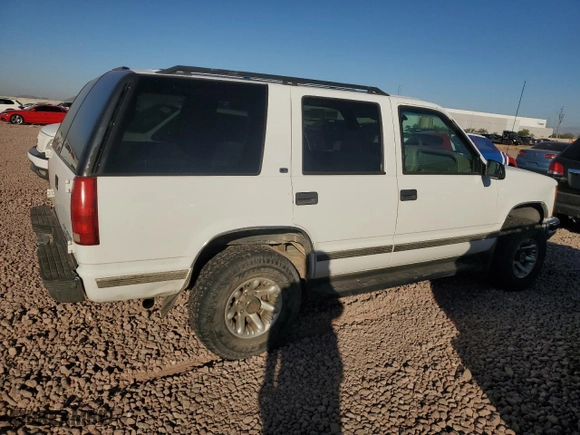 1999 Chevrolet Tahoe Z71 with VIN 1GNEK13R9XJ381424, listed as a Copart auction lot 79940494 with 164,231 mi miles and Salvage Title. Bid and sale history available at carsss.com. Image 3.
