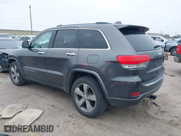2014 Jeep Grand Cherokee Overland with VIN 1C4RJECG5EC207211, listed as a IAAI auction lot 41586309 with 115,293 mi miles. Bid and sale history available at carsss.com. Image 3.