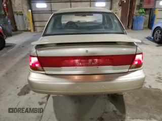 1999 Saturn SL z VIN 1G8ZK5277XZ266298, wystawiony jako Copart lot #41371855 z przebiegiem 85 882 mil mil oraz Szkoda całkowita • Salvage title. Historia ofert i sprzedaży dostępna na DreamBid. Obrazek 6.