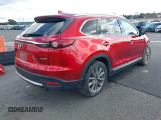2020 Mazda CX-9 Grand Touring with VIN JM3TCBDY4L0423563, listed as a IAAI auction lot 41829394 with 76,704 mi miles and . Bid and sale history available at DreamBid. Image 4.