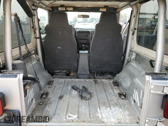 2003 Jeep Wrangler Sport z VIN 1J4FA49S93P306817, wystawiony jako Copart lot #60136385 z przebiegiem 217 208 mil mil oraz Czysty tytuł • Clean title. Historia ofert i sprzedaży dostępna na DreamBid. Obrazek 11.