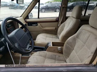 1995 Jeep Cherokee Country with VIN 1J4FJ78S3SL557728, listed as a Copart auction lot 55109494 with 203,347 mi miles and Salvage Title. Bid and sale history available at carsss.com. Image 7.