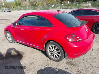 2018 Volkswagen Beetle S with VIN 3VWFD7AT5JM725878, listed as a IAAI auction lot 41743855 with 108,068 mi miles. Bid and sale history available at carsss.com. Image 3.