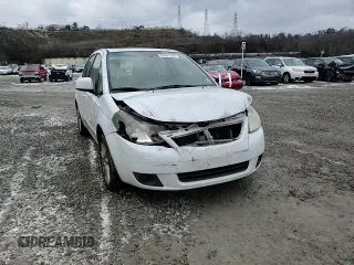 2011 Suzuki SX4 LE z VIN JS2YC5A29B6302397, wystawiony jako Copart lot #82691304 z przebiegiem 251 382 mil mil oraz Szkoda całkowita • Salvage title. Historia ofert i sprzedaży dostępna na DreamBid. Obrazek 11.