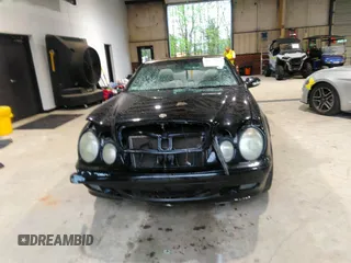 2000 Mercedes-Benz CLK 320/430 z VIN WDBLK65G5YT031236, wystawiony jako IAAI lot #41972975 z przebiegiem 144 665 mil mil oraz . Historia ofert i sprzedaży dostępna na DreamBid. Obrazek 13.