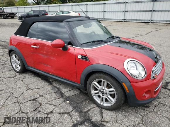 2011 MINI Convertible with VIN WMWZN3C51BTZ78331, listed as a Copart auction lot 73348304 with 94,219 mi miles and Salvage title. Bid and sale history available at DreamBid. Image 4.